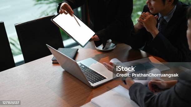 Cropped Shot Businesswoman Showing Digital Tablet Empty Screen In Meeting Room Stock Photo - Download Image Now