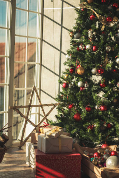 istock Christmas morning with all the gifts under a tree 1271518163
