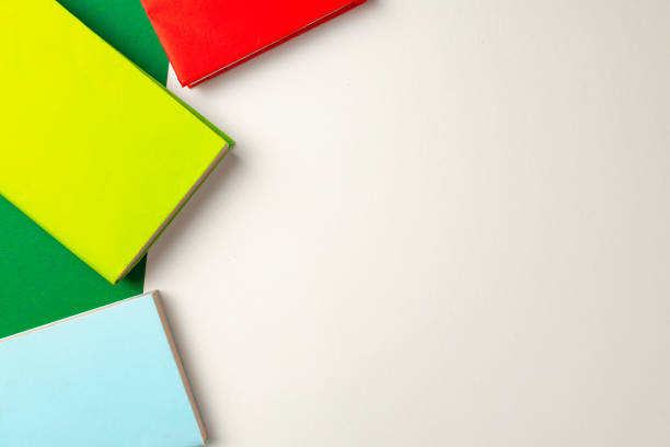 istock Three colorful notepads on desk top view 1271518265