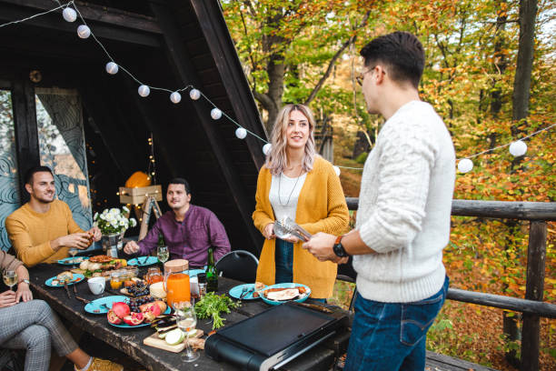 istock Group of friends deciding who will be indebted for a barbecue 1271518653
