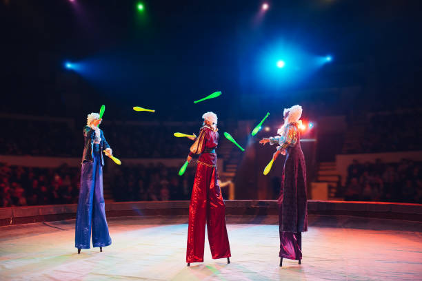 The performance of stilt-walkers in the circus stock photo