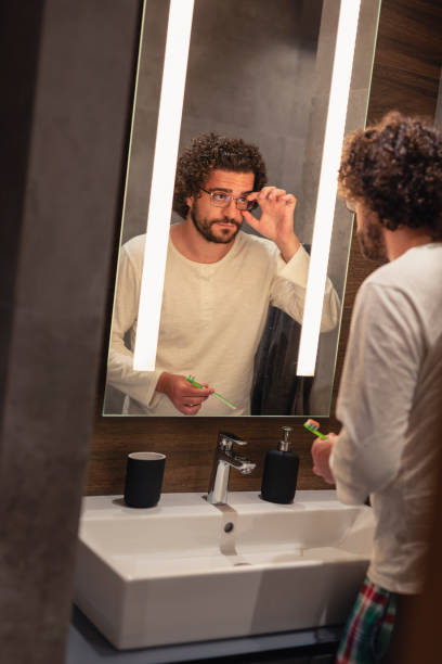 istock Man getting freshing up in bathroom 1271521673