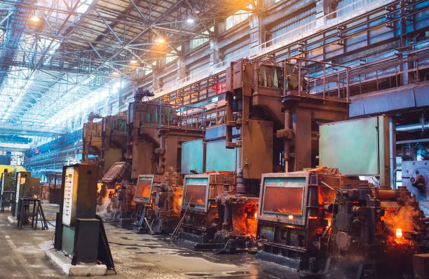 istock hot steel on conveyor in steel mill. 1271521793