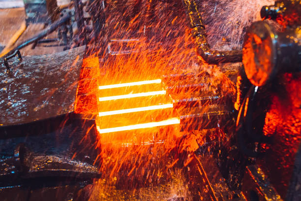 istock hot steel on conveyor in steel mill. 1271521823