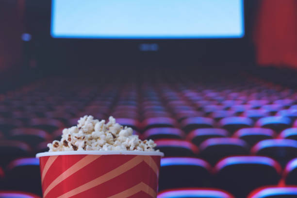 pop corn and on red armchair cinema Movie Theater, Movie, Popcorn, Film Industry, Projection Screen movie theater photos stock pictures, royalty-free photos & images