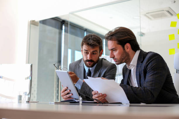 istock The boss shows his employee the new mistakes he noticed in his work, the boss explains problems 1271522900