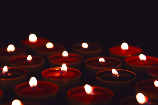 istock Burning red candles on a dark background. 1271523863