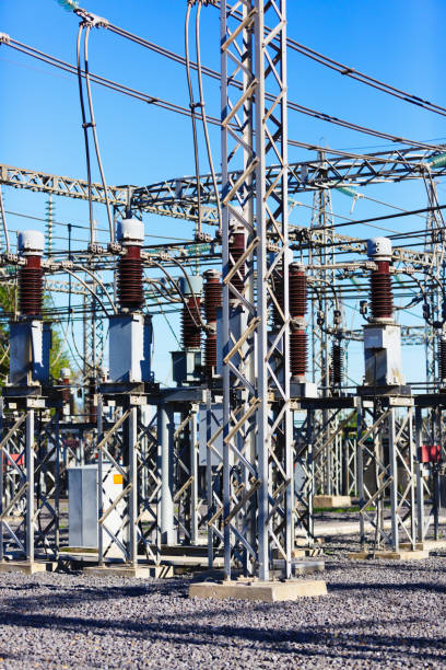 istock Box-girder structures, glass insulators and power lines at a large electricity substation 1271524129