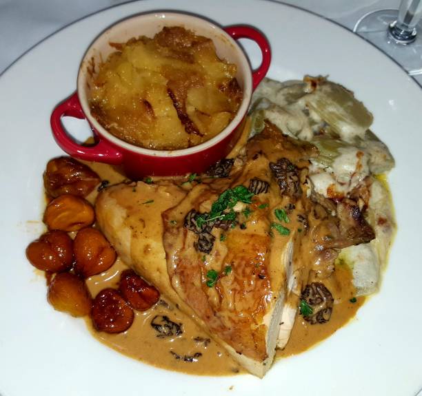 istock Chicken thigh with chestnut sauce with gratin potatoes 1271526034