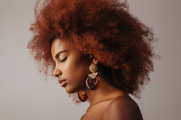 istock Beautiful afro girl with earrings 1271526470