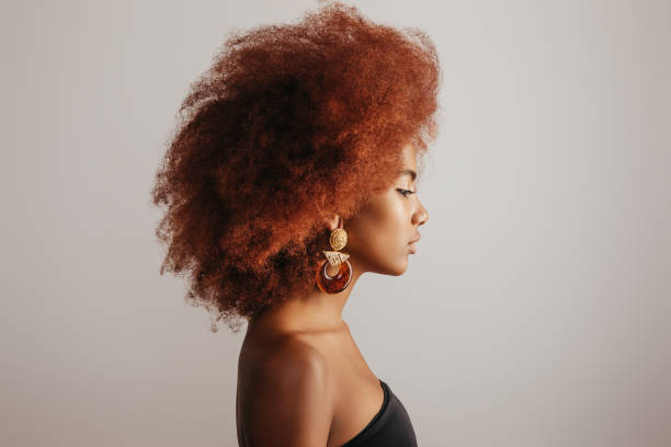 istock Beautiful afro girl with earrings 1271526525