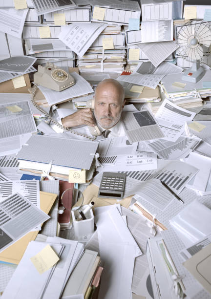 istock Stressed businessman overwhelmed by work 1271527286