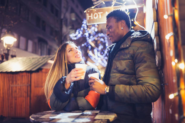 istock Diverse couple on Christmas market 1271529710