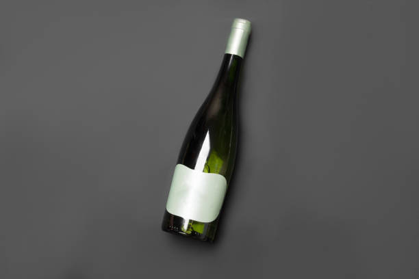 bottle of wine on black colored paper background