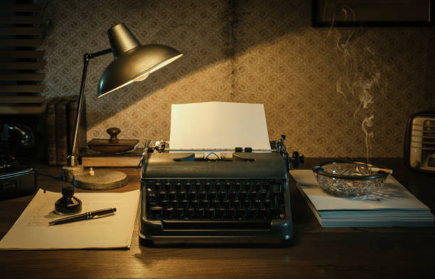 istock Vintage film noir office desk with old typewriter 1271531349