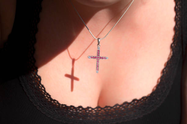 istock The Religious cross on the woman's chest with shadow 1271533210