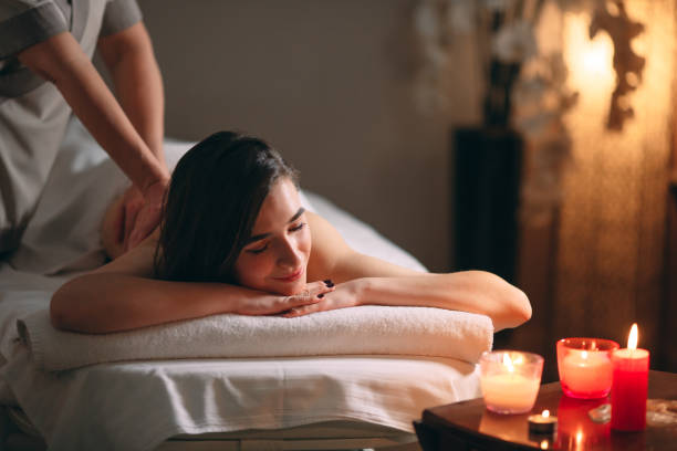 istock Spa, massage. Young dark-haired beautiful girl doing massage. 1271538540