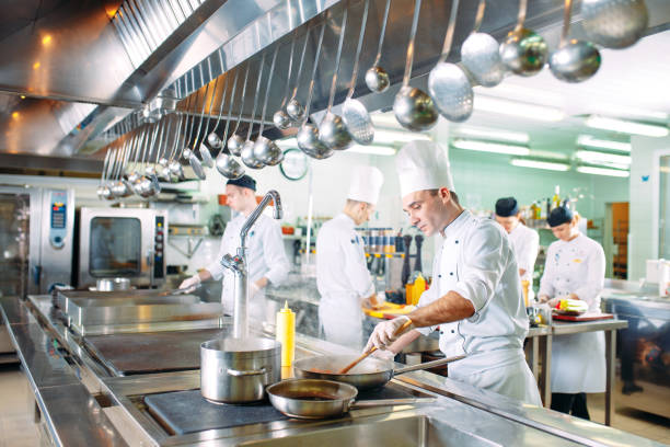 istock Modern kitchen. The chefs prepare meals in the restaurant's kitchen. 1271539305