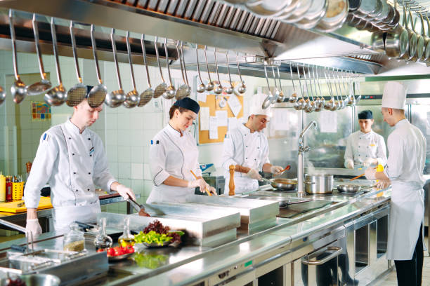 istock Modern kitchen. The chefs prepare meals in the restaurant's kitchen 1271539411