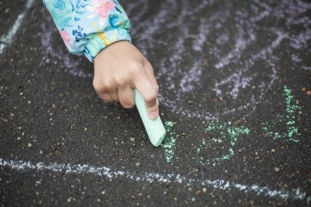 istock Drawing with chalk on the pavement. 1271542809