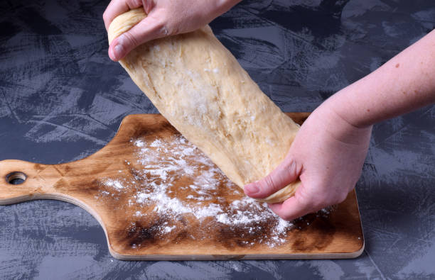 istock Woman hands kneading the yeast dough 1271547434