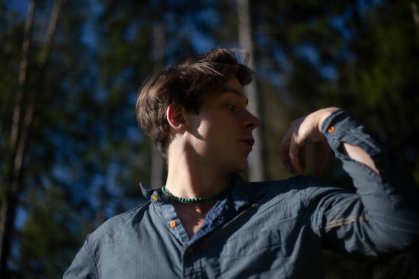 istock A guy in a shirt in a birch grove. 1271547600