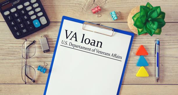 Paper with VA loan - U.S. Departament of Veterans Affairs on the table stock photo