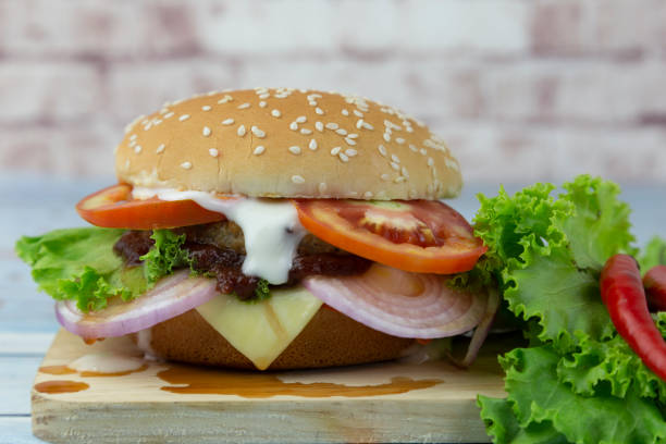istock Beef burger with tomato, onion and cheese on a stick 1271550309