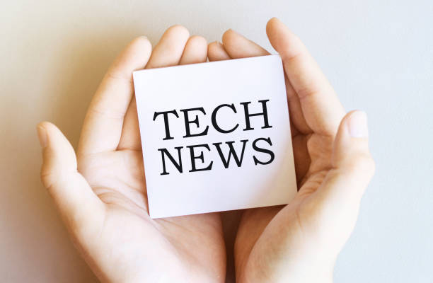 istock white paper with text Tech News in male hands on a white background 1271550526