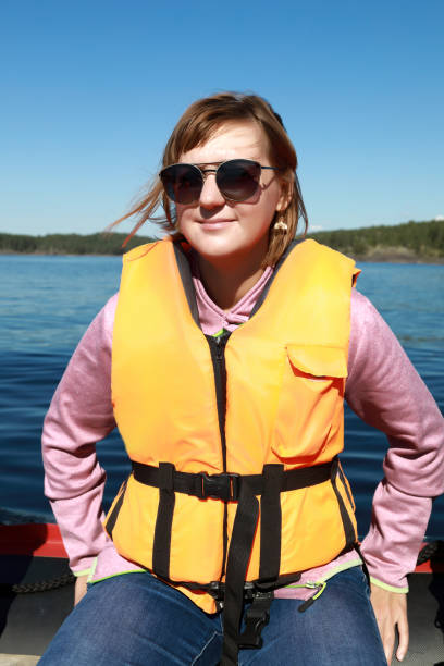 istock Woman in life jacket on boat 1271550920