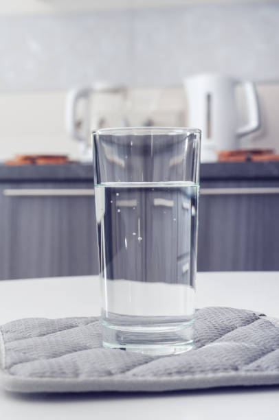 istock Glass with pure water on a table 1271552138