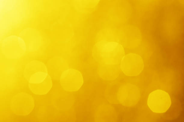 istock glitter light sparkle yellow golden gorgeous bokeh defocused abstract background shiny. 1271552551