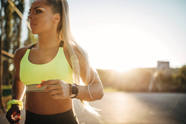 istock Beautiful female athlete jogging outside 1271553976
