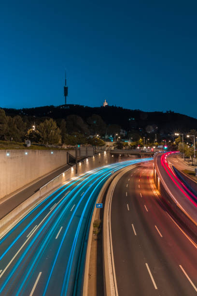istock Light trails in Barcelona city road 1271554000