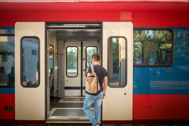 istock Man standing on the subway platform, waiting for his train 1271554205