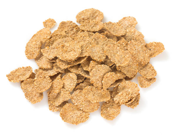 istock Pile of bran flakes isolated on white 1271555165