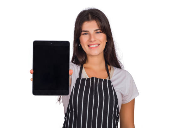 istock Woman chef showing something on digital tablet. 1271555327