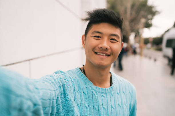 istock Asian man taking a selfie. 1271555637