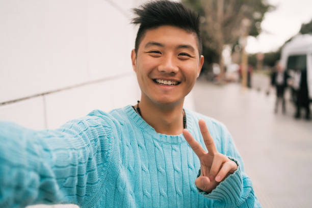 istock Asian man taking a selfie. 1271555648