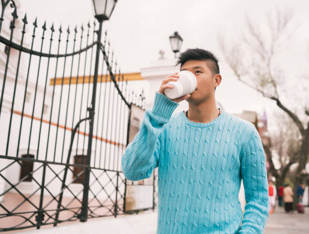 istock Asian man drinking a cup of coffee. 1271555653