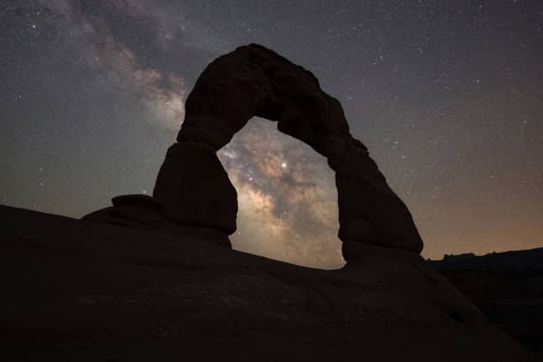 istock Silhouette of Delicate Arch under the Milky Way Galaxy 1271555889