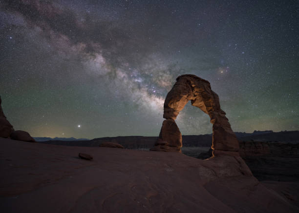 istock Milky Way Galaxy rising behind Delicate Arch in Utah 1271555951