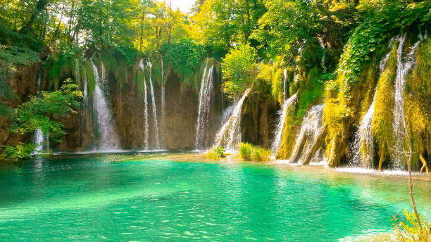 istock Waterfall playing in the summer sun 1271559824