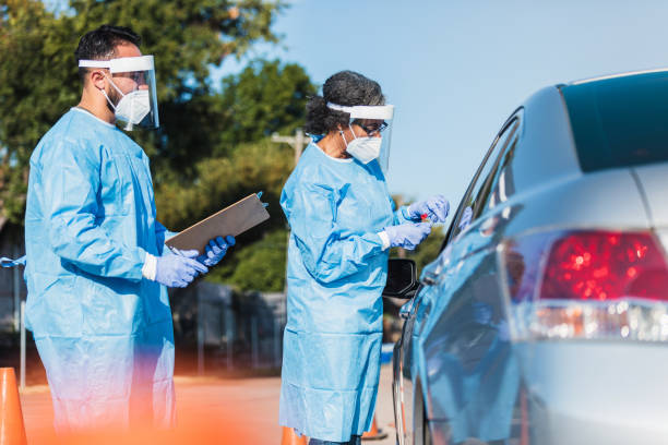 istock As next car pulls up, healthcare workers prepare to administer test 1271559833