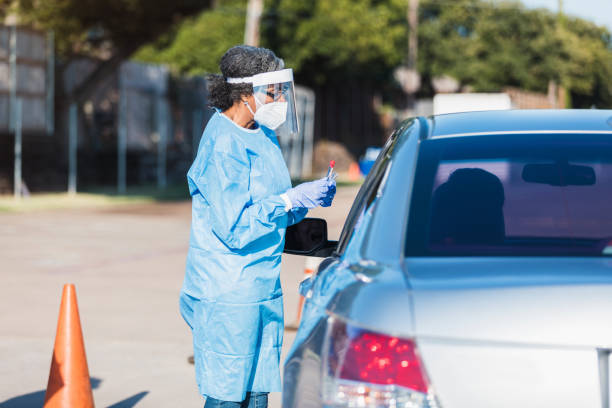 istock Female doctor instructs unrecognizable person about COVID-19 test 1271559927