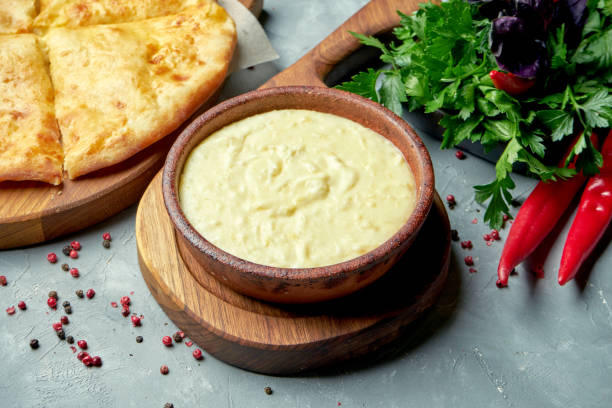 istock Georgian dish shusha - mashed potatoes with milk and melted cheese in a composition with khachapuri on a gray background 1271561659