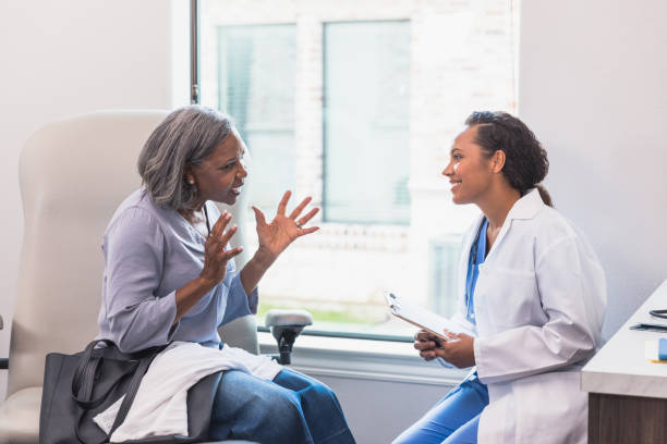 istock Attentive doctor listens to patient 1271562563