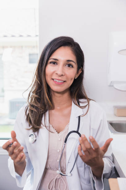 istock Confident doctor talks to patient during virtual appointment 1271562641