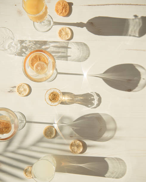 flat lay of glasses and cups in harsh light - wine abstract drink alcohol imagens e fotografias de stock