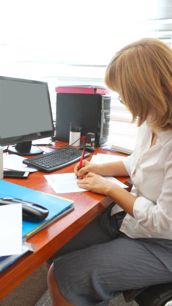 istock Mature Woman Librarian at her work 1271564019
